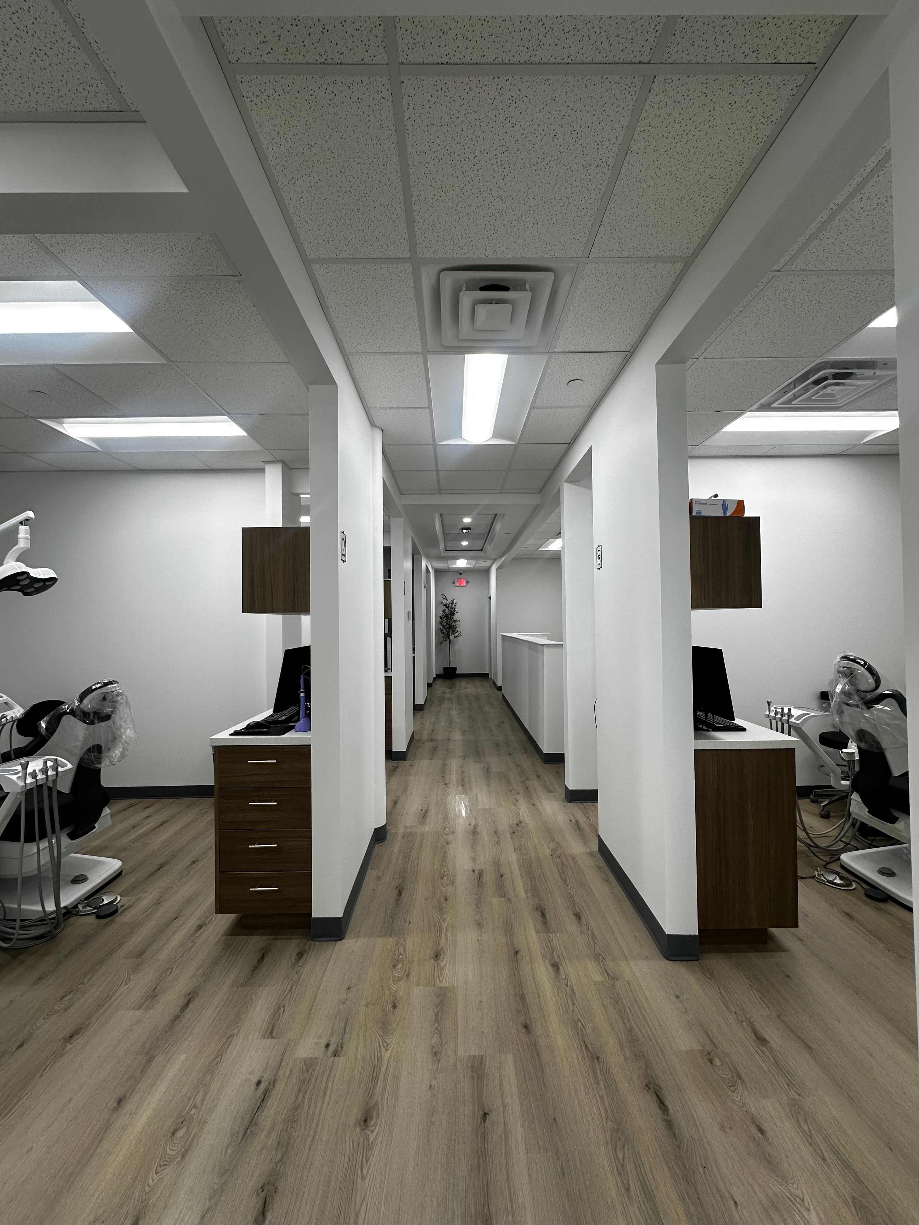 AURA Dental modern office hallway with treatment rooms serving Menomonee Falls WI